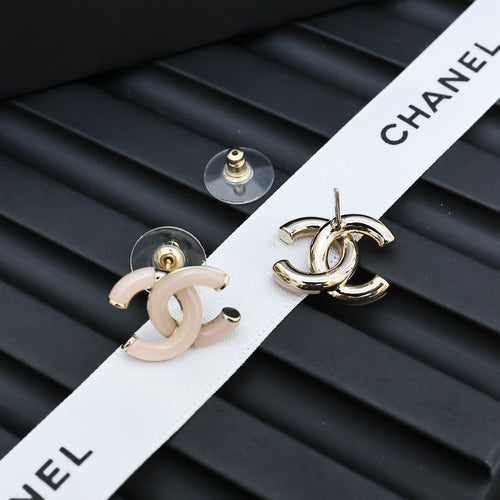 Chanel CC stud earrings in white enamel with gold-tone posts and backs