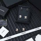 Chanel CC earrings set in a box with matching studs in light and dark tones