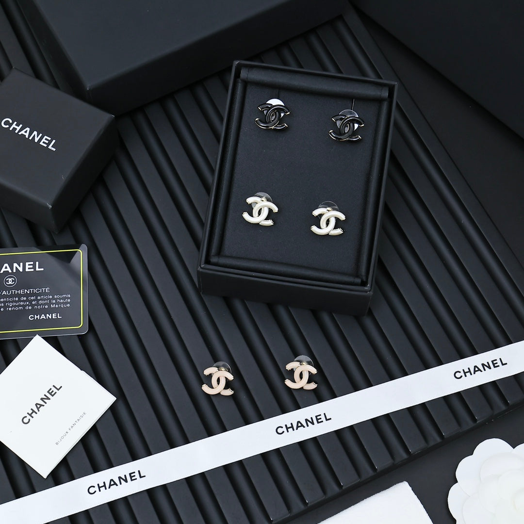 Chanel CC earrings set in a box with matching studs in light and dark tones