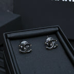 Chanel CC stud earrings with black enamel and silver-tone posts