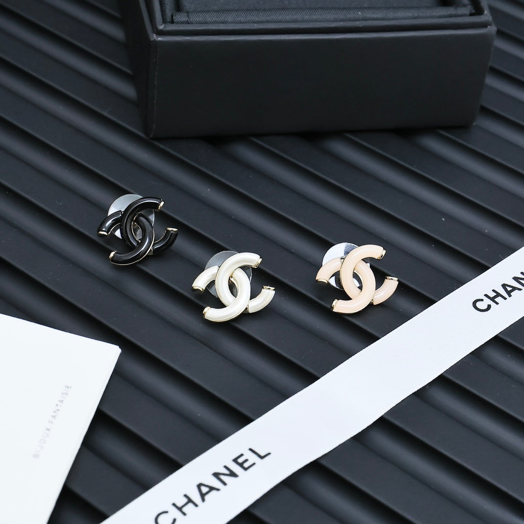 Chanel CC stud earrings with black enamel and white enamel pairs