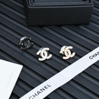 Chanel CC stud earrings with black enamel and white enamel pairs