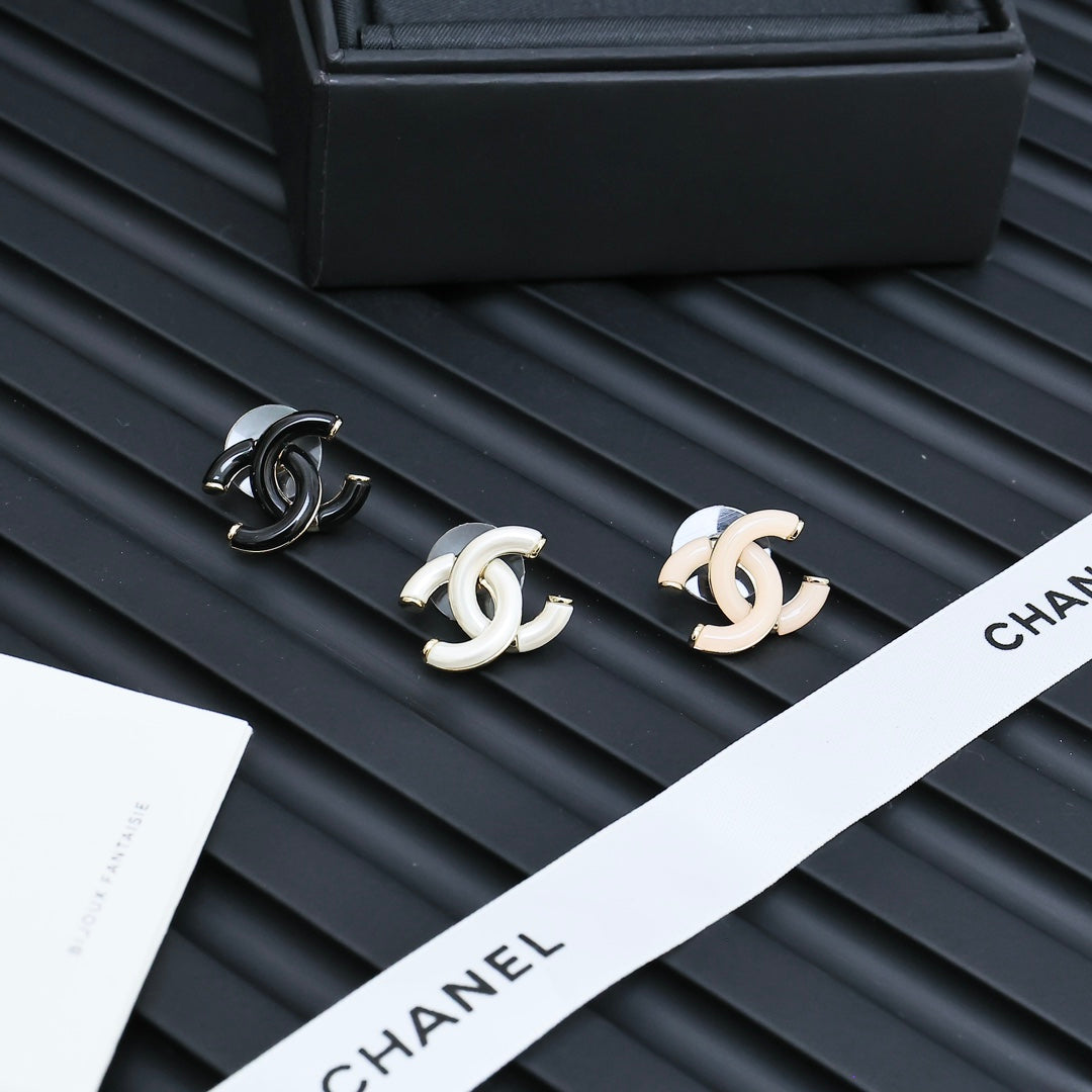 Chanel CC stud earrings with black enamel and white enamel pairs