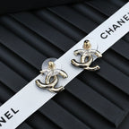 Chanel CC stud earrings with light blue enamel and gold-tone hardware