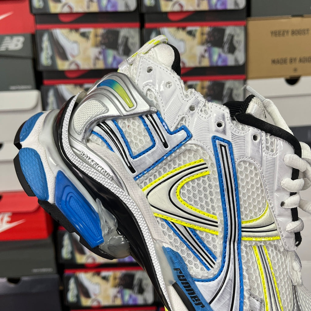 Unisex athletic shoes, white and silver with blue and neon green panels, lace-up