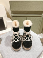 Black high-top boots with white laces and faux-fur cuffs, beige rubber soles.