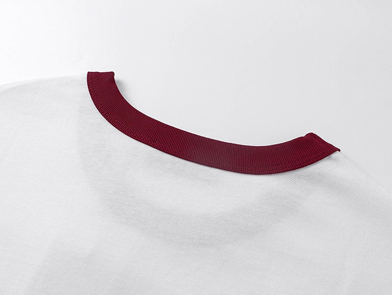 Burgundy ribbed crew collar on white T-shirt