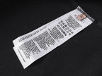 Black T-shirt interior with white care label tag at the neck