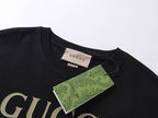 Black T-shirt neckline with Gucci neck label and partial logo graphic