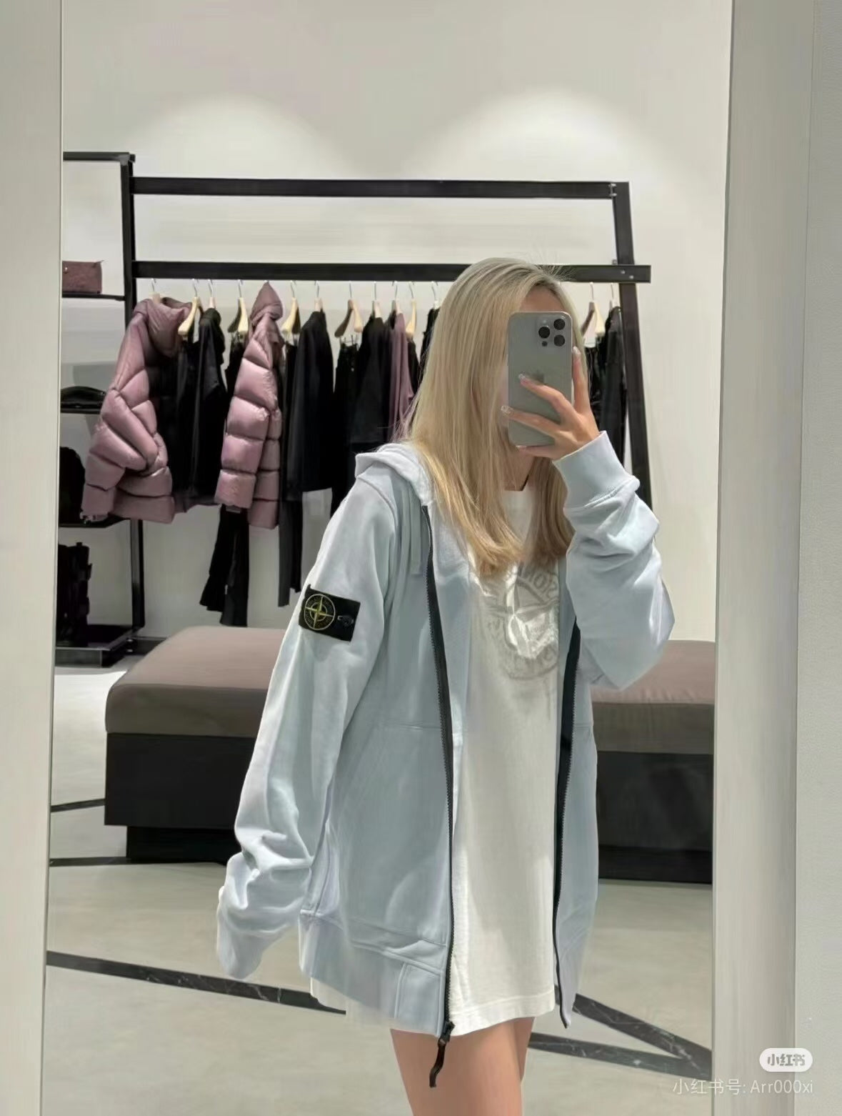 Light gray Stone Island hooded zip jacket with drawstring hood and sleeve logo patch