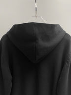 Black hoodie back with hood and ribbed cuffs.