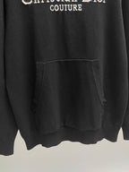 Black hoodie with front kangaroo pocket and ribbed hem.