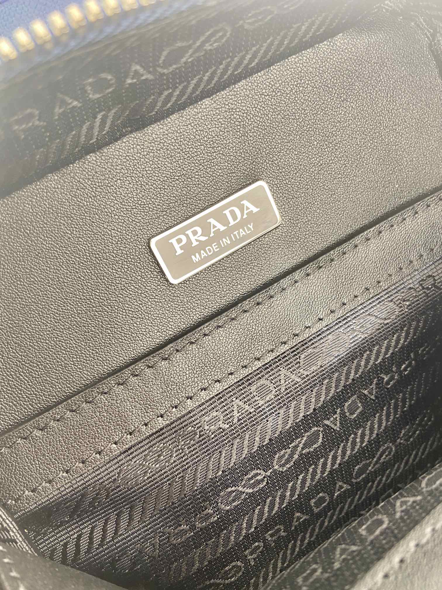 Gray interior label reading Prada and Made in Italy on patterned lining