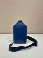 Blue mini crossbody bag with front flap and adjustable black shoulder strap