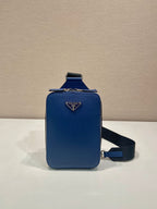 Blue mini crossbody bag with Prada triangle logo and adjustable black strap