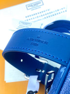Louis Vuitton blue strap with gold buckle and “LOUIS VUITTON PARIS” embossing