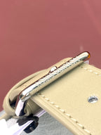 Louis Vuitton monogram bag zipper pull and stitching on light blue exterior