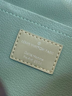 Louis Vuitton inside leather label patch with stitched border, light blue