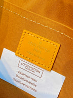 Leather label on tan monogram handbag: Louis Vuitton Paris made in France