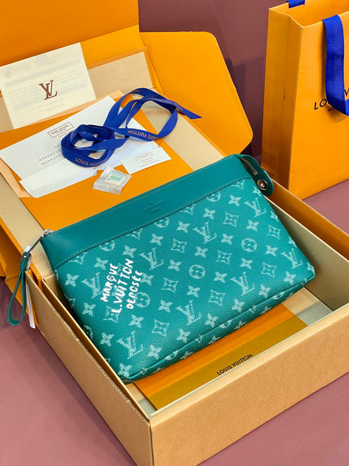 Teal Louis Vuitton small crossbody bag with blue strap and monogram pattern in box