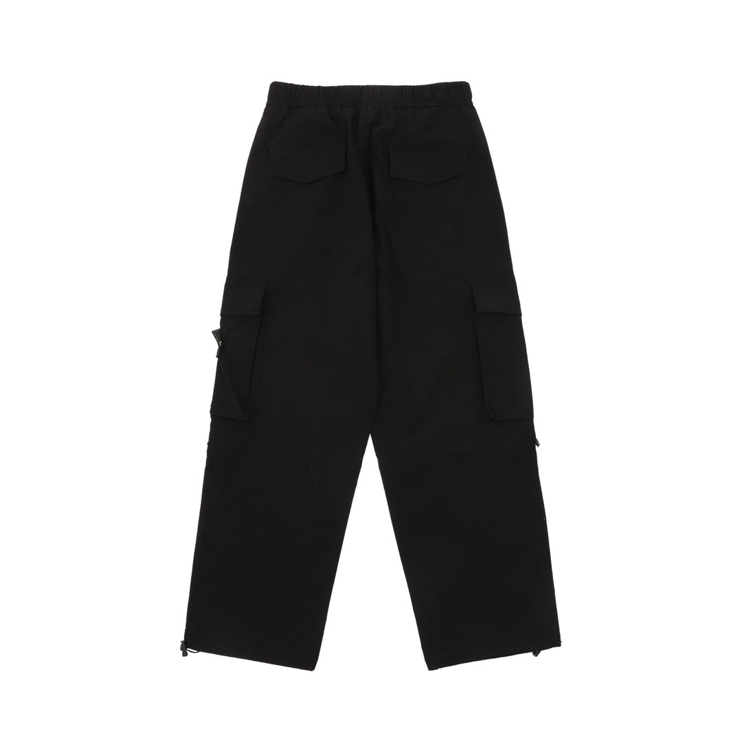 Black cargo shorts with flap pockets, knee-length