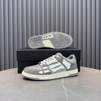 Low-top sneaker outsole view on box: silver and white upper with textured rubber tread
