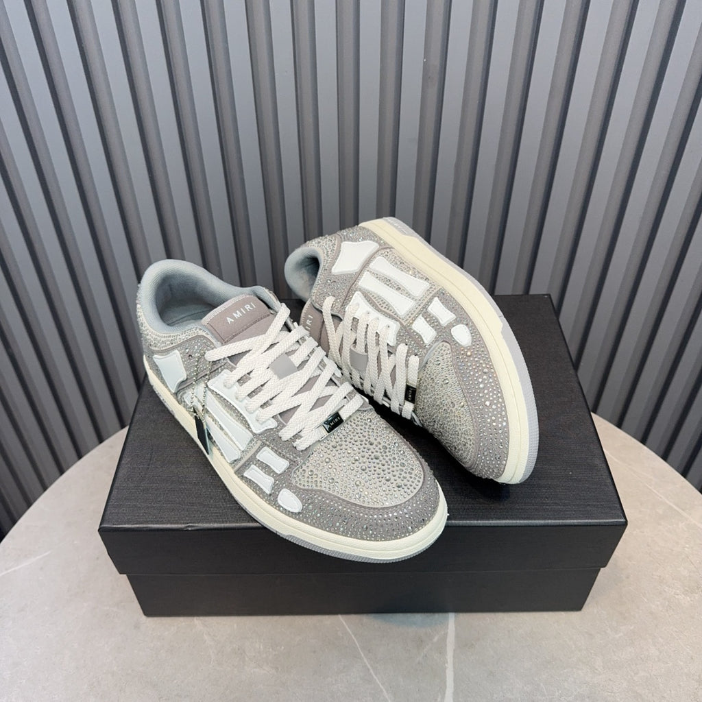 Low-top sneakers on box: silver speckled uppers, white stripes, and gray-blue interior