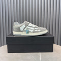 Men's low-top sneaker in silver speckled suede with white panels and lace-up design
