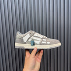 Low-top sneaker view with silver glitter texture, white side stripes, and blue hang tag