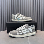 Low-top sneaker with silver speckled texture, white overlays, and light-blue accessory tag