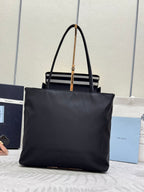 Black Prada tote bag with top handles and triangle logo on front