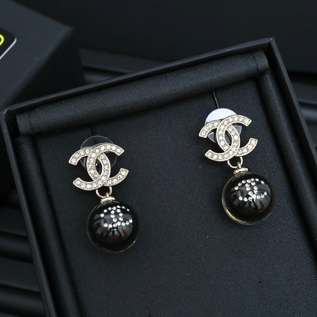Chanel drop earrings with silver CC motif and black sphere dangles