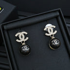 Chanel drop earrings with silver CC motif and black sphere dangles