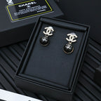 Chanel drop earrings with silver-tone CC logo and black ball beads