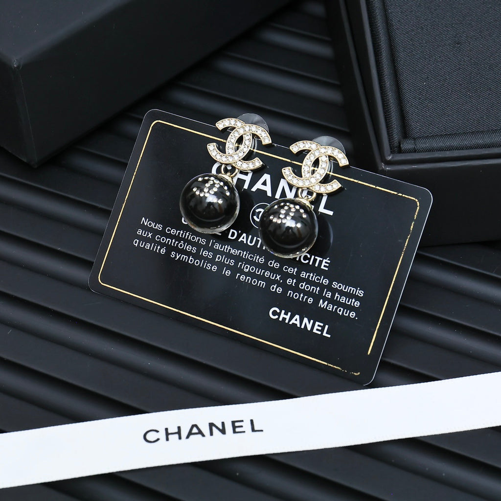 Chanel earrings with black ball beads and silver-tone CC motifs in gift box
