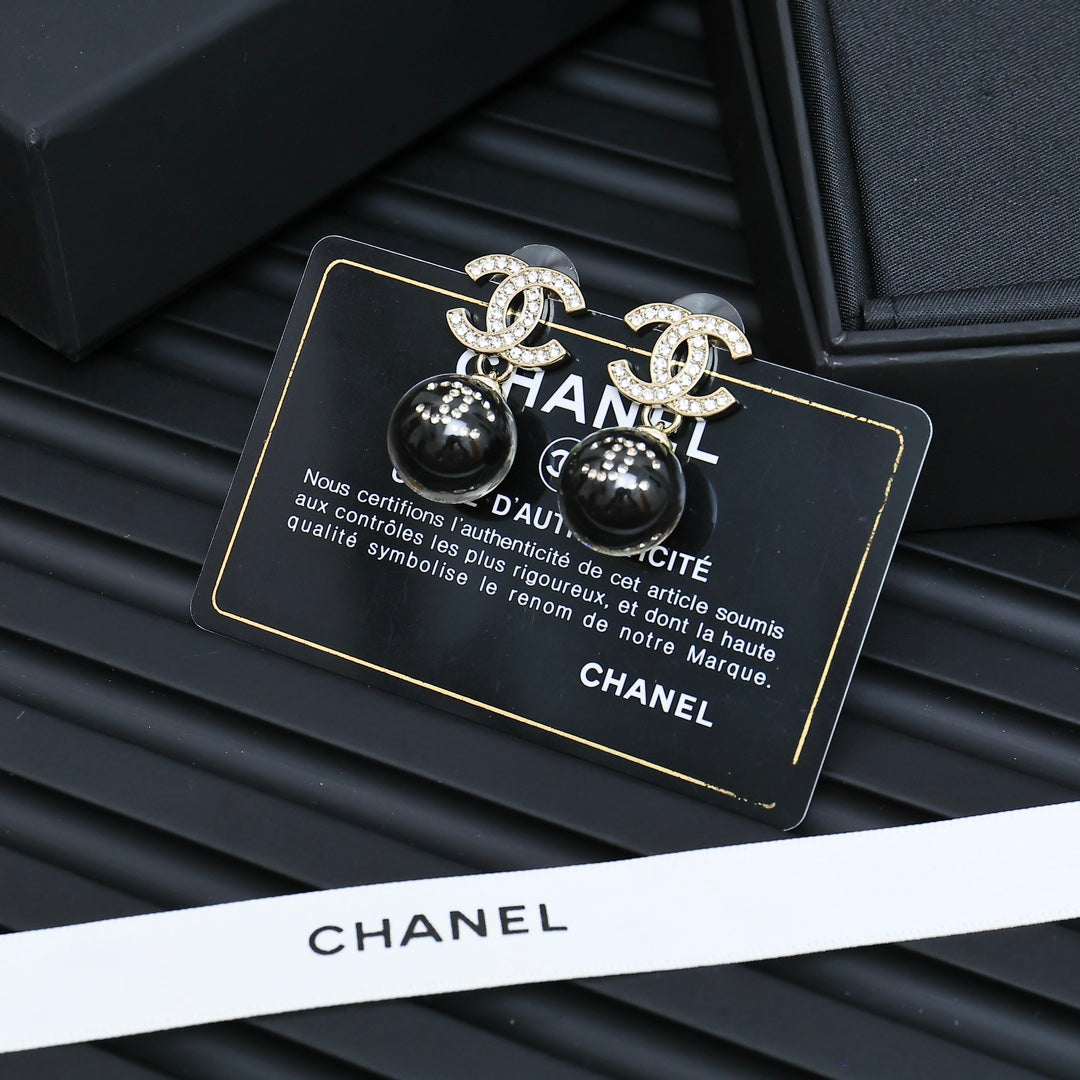 Chanel earrings with black ball beads and silver-tone CC motifs in gift box