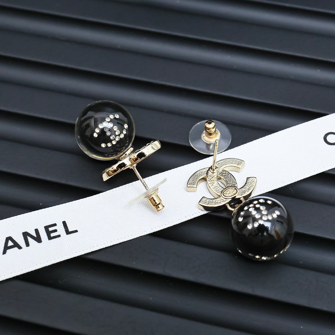Chanel stud earrings with black sphere beads and silver-tone CC charms