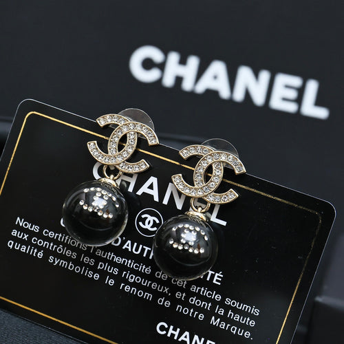 Chanel stud earrings with silver-tone CC logo and black round bead