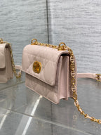 Dior pale pink quilted shoulder bag side view with gold chain hardware
