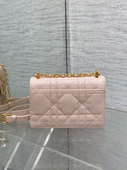 Dior pale pink quilted crossbody bag with gold chain and top handle