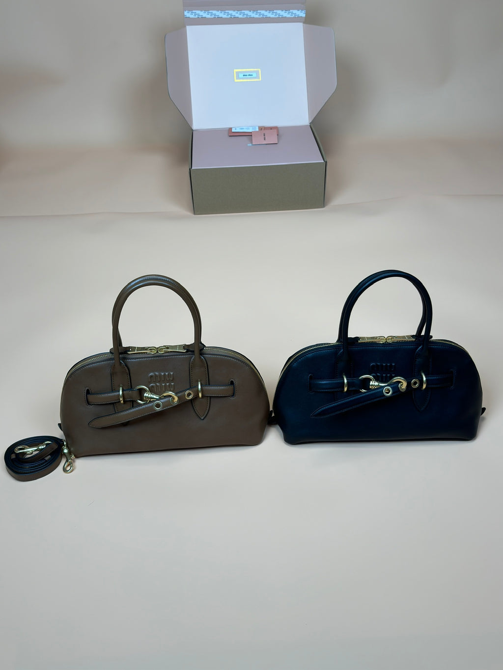 Miu Miu top-handle handbags set: dark olive and navy, with crossbody straps