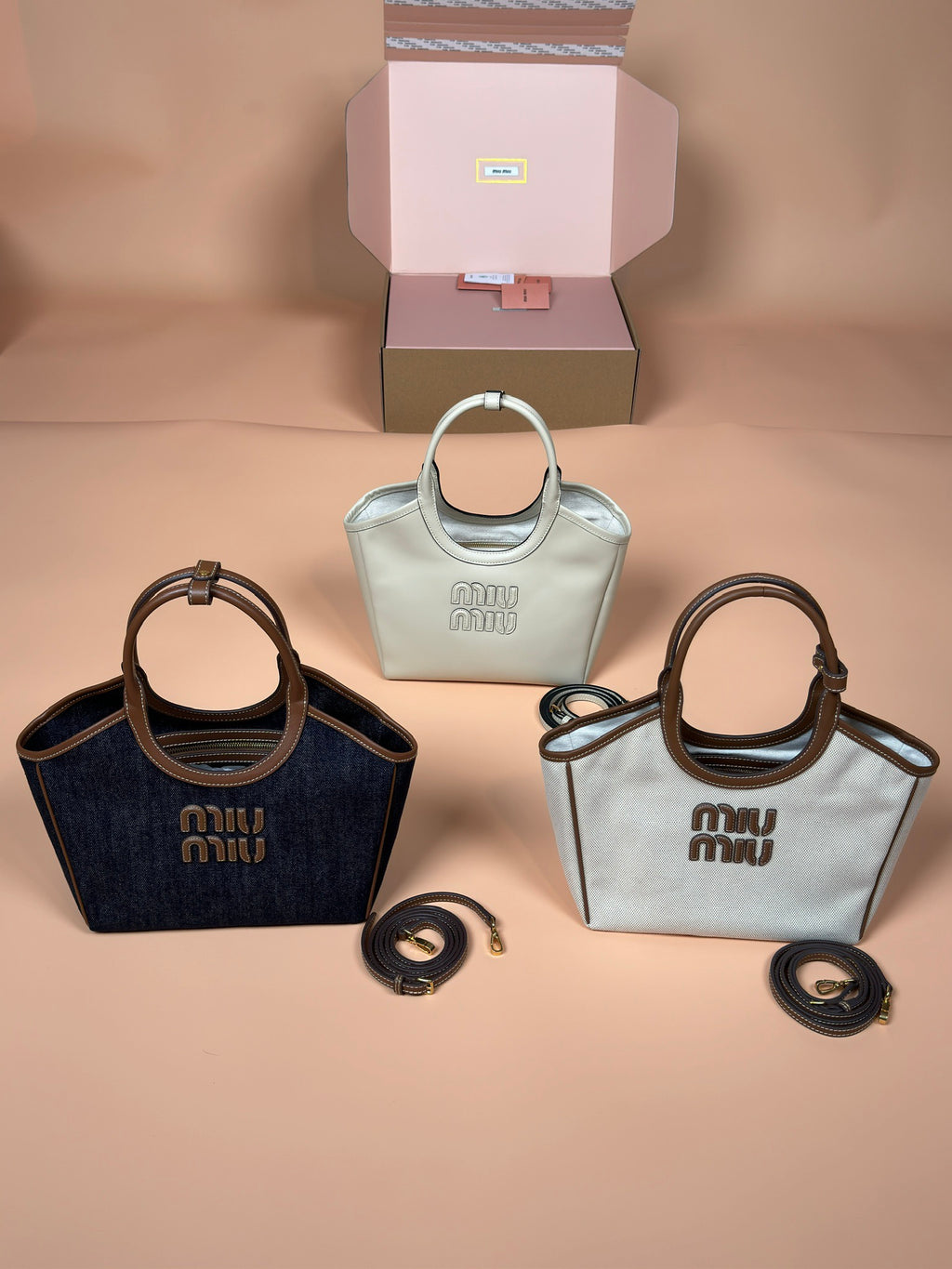 Assorted Miu Miu handbags, including mint and navy top-handle styles with straps