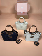 Assorted Miu Miu handbags, including mint and navy top-handle styles with straps