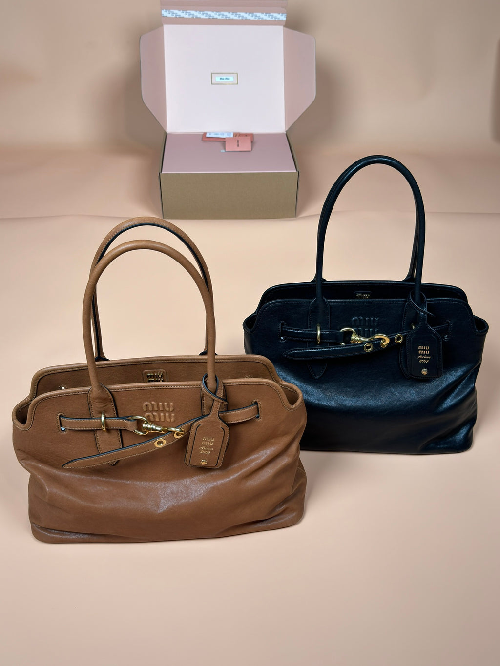 Miu Miu handbags, two-tone set with tan top-handle and dark blue top-handle
