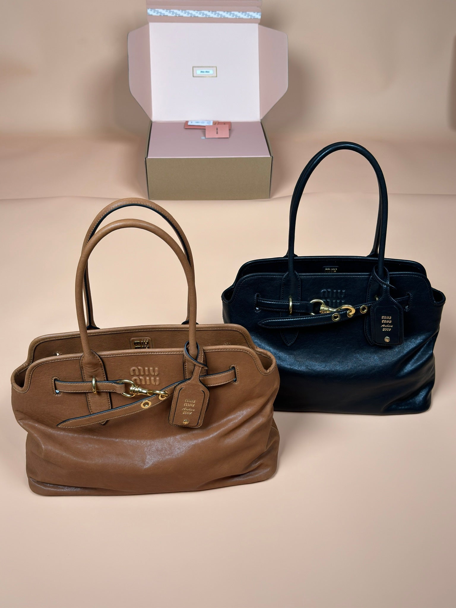 Miu Miu handbags, two-tone set with tan top-handle and dark blue top-handle