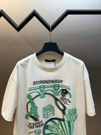 White short-sleeve T-shirt with central green and blue illustration and printed text