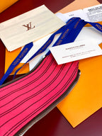 Louis Vuitton monogram toiletry bag zipper and pink interior stripe detail
