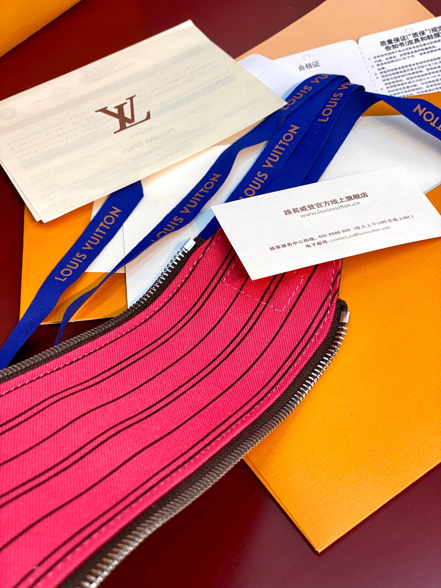Louis Vuitton monogram toiletry bag zipper and pink interior stripe detail