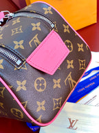 Louis Vuitton monogram toiletry bag side view with pink leather patch