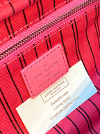 Louis Vuitton monogram toiletry bag pink fabric interior label close-up